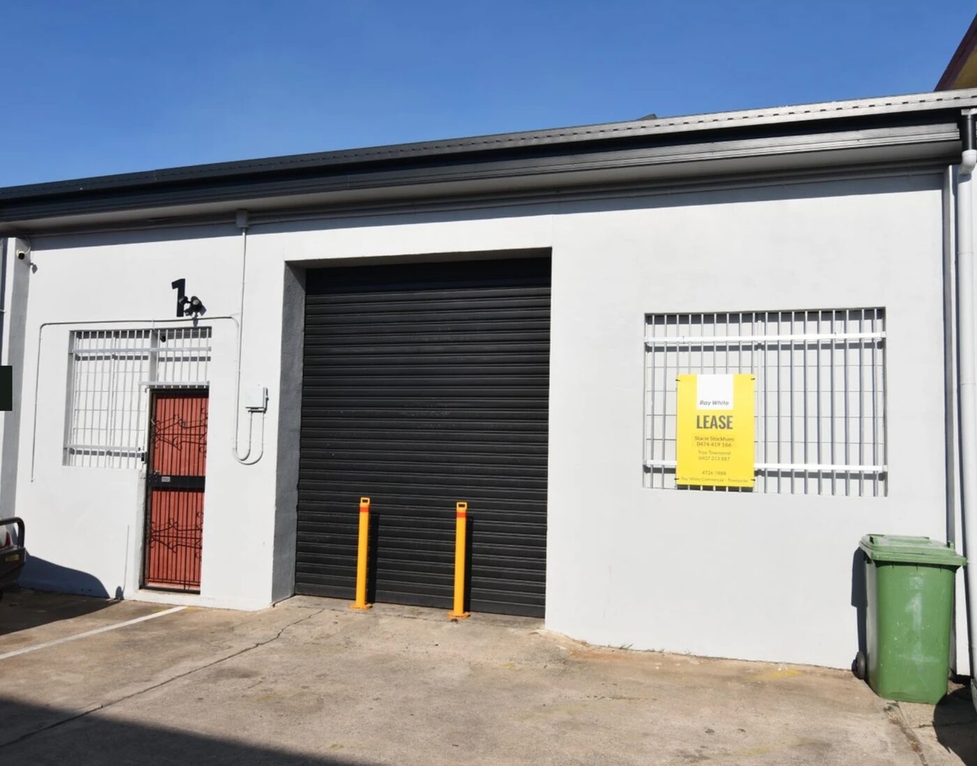Unit 1 frontage — roller door and personnel door