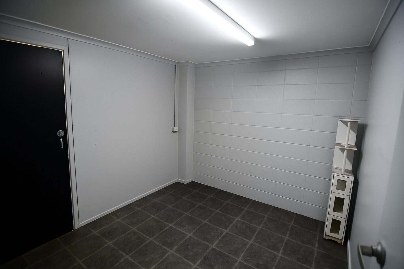 Enclosed office within the warehouse — freshly painted with tiled floor